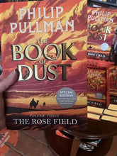 Load image into Gallery viewer, The Rose Field (Book of Dust 3) - by Phillip Pullman INDIE EXCLUSIVE EDITION with red sprayed edges and exclusive Chris Wormall illustration